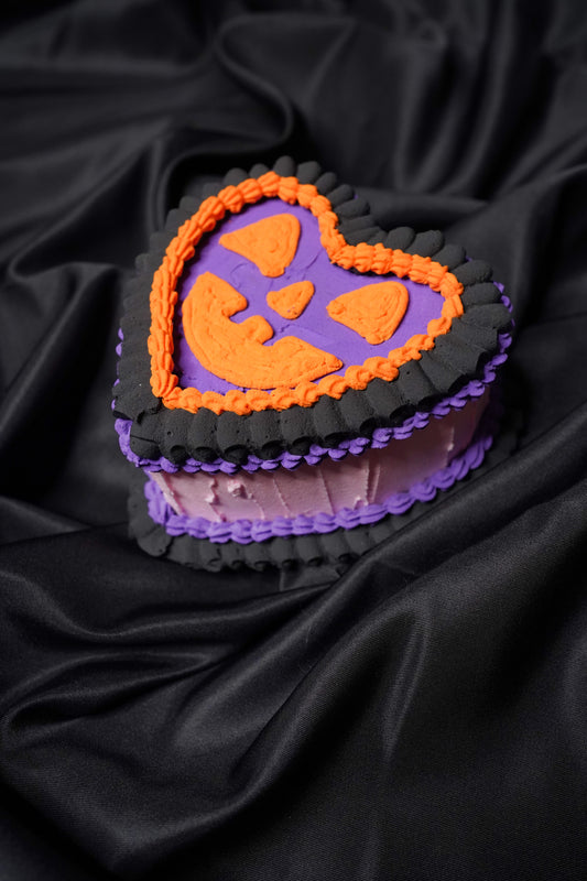 Small Pink and Purple Heart Shaped Jack O Lantern Fake Cake